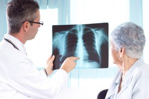 doctor reviewing x-ray with patient 
